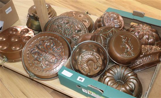 A quantity of copper jelly moulds